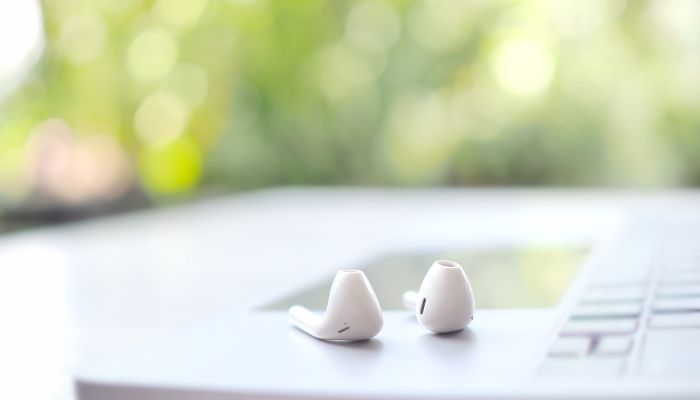 Airpod and Macbook on the table 